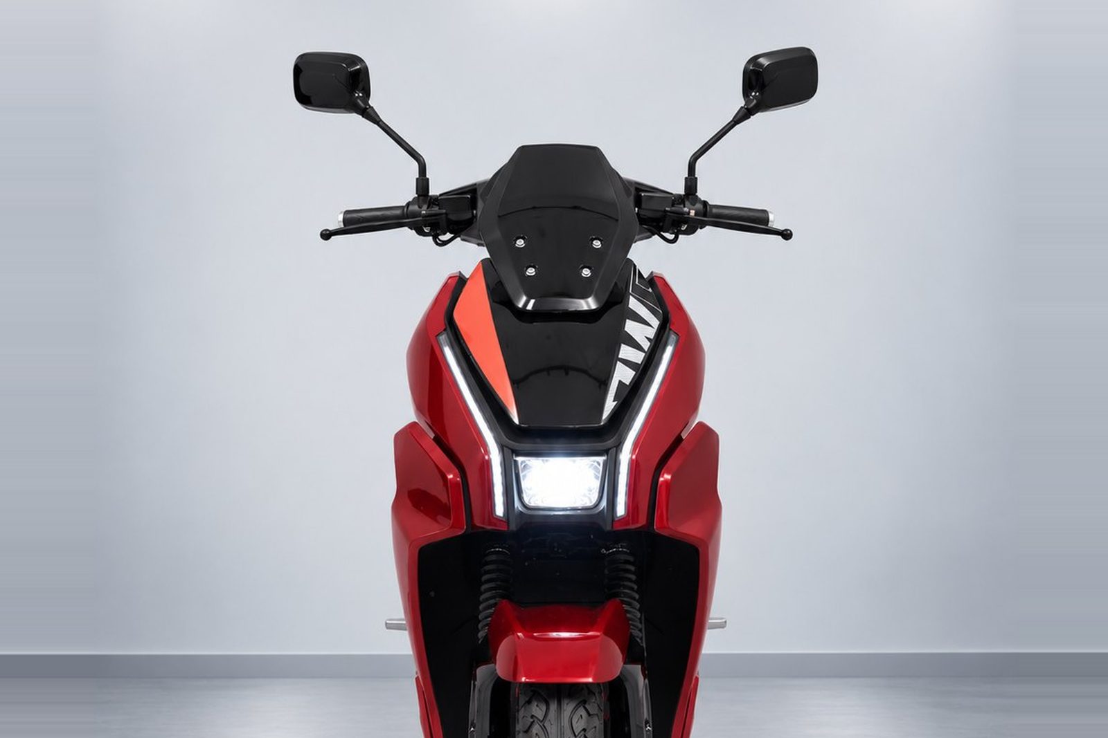 A BNW electric scooter shown in each of its five colours: red, black, green, white and grey