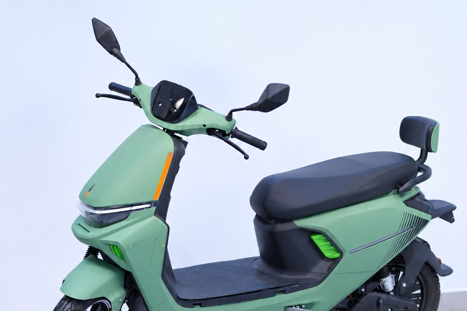 A rider seated on a BNWIE electric vehicle in the studio