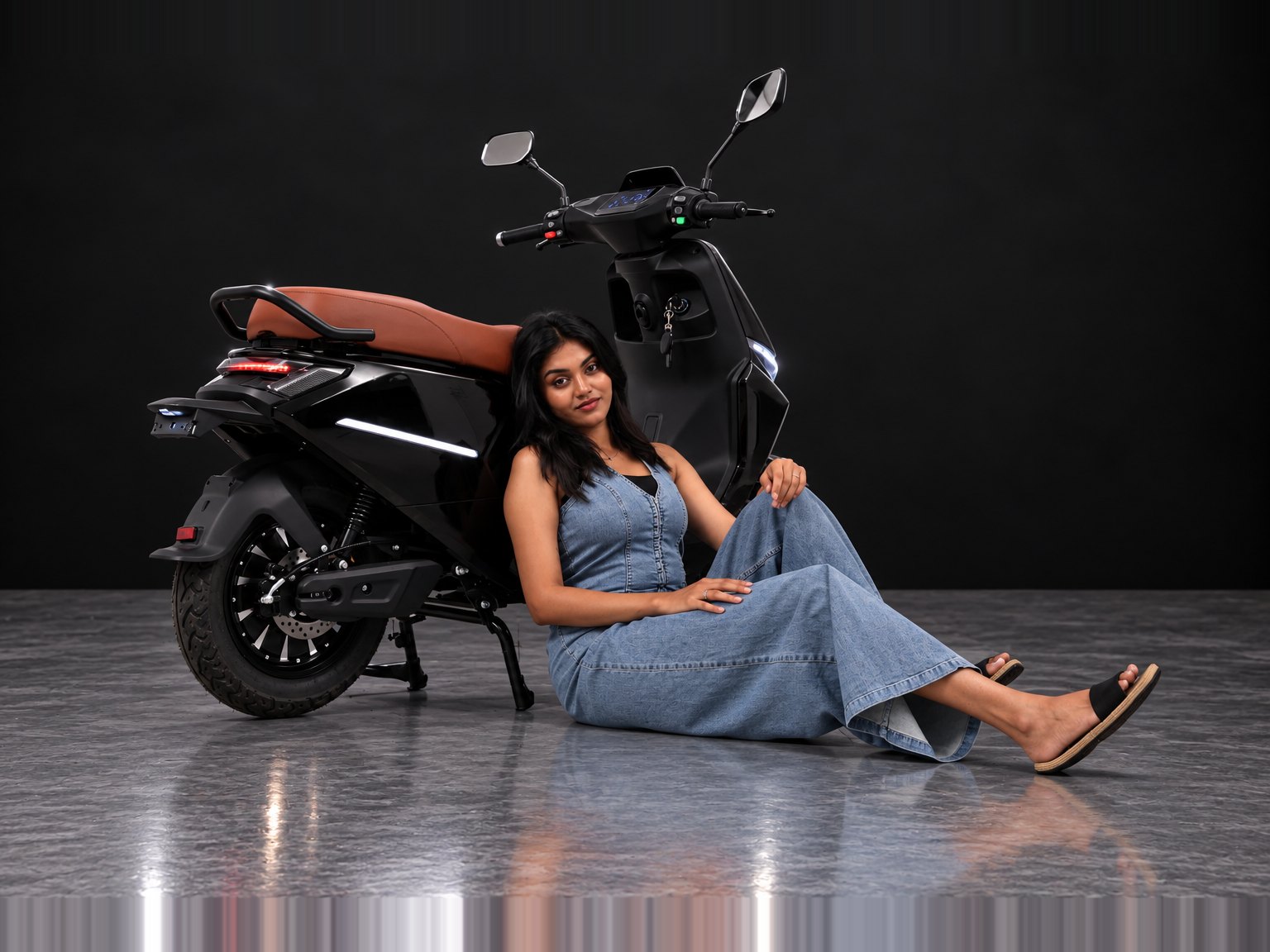 M2 in Black, rear three-quarter view with rider